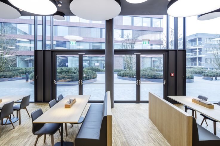 Staff restaurant with two double-leaf glass doors.