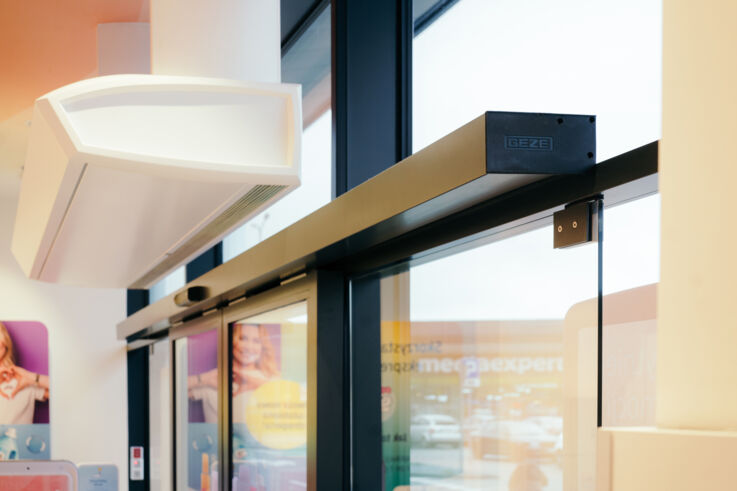 View of a door operator on a sliding door in a dm store.
